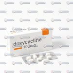 A bottle of Doxycycline capsules, an antibiotic used to treat various bacterial infections, displayed with dosage information, available at CureTypes.com.